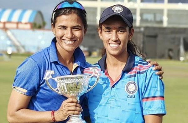 Coach Anagha Deshpande with the U19 Women's Team holding the Championship Trophy. PC: Instagram